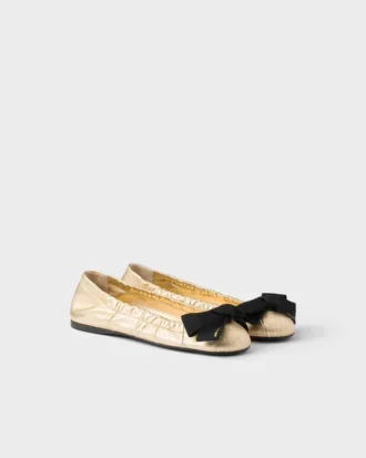 Ballerinaskor i Mordora-nappaläder med rosett