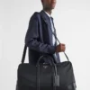 Duffelväska i Re-Nylon och Saffiano-läder Duffelväska i Re-Nylon och Saffiano-läder