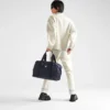 Duffelväska i Re-Nylon och Saffiano-läder Duffelväska i Re-Nylon och Saffiano-läder