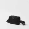 Prada Brique väska i Re-Nylon och Saffiano-läder