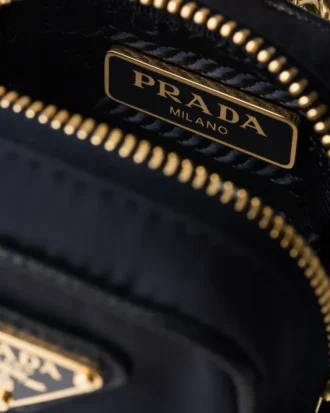 Prada Re-Edition 1978 Re-Nylon miniväska med nyckelring