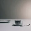 Set med fyra espressokoppar i porslin – rutmönster Set med fyra espressokoppar i porslin – rutmönster