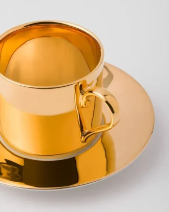 Tekopp i porslin – massivt guld